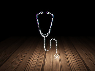 Image showing Healthcare concept: Stethoscope in grunge dark room