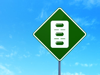 Image showing Healthcare concept: Pills Blister on road sign background