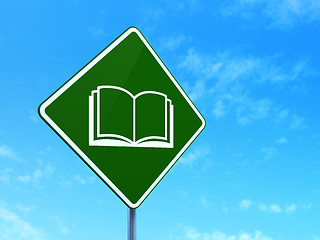 Image showing Science concept: Book on road sign background