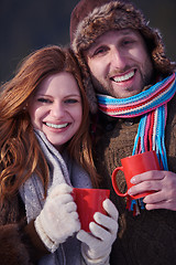 Image showing couple drink warm tea at winter