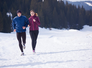 Image showing couple jogging outside on snow