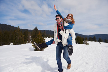 Image showing happy young couple having fun on fresh show on winter vacation