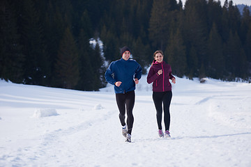 Image showing couple jogging outside on snow