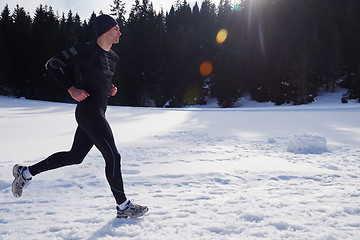 Image showing jogging on snow in forest