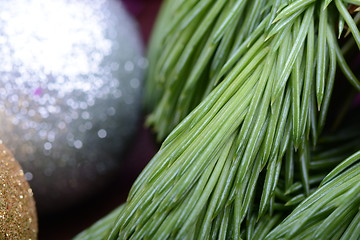 Image showing Closeup of beautiful Christmas baubles, Decorated christmas tree, holiday background, green tree eve branch close up with christmas balls 