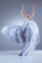 Image showing The beautiful ballerina dancing in blue long dress 