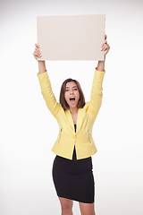 Image showing Businesswoman showing board or banner with copy space on white background 