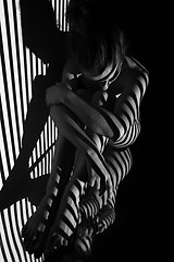 Image showing The nude woman with black and white zebra stripes