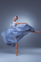 Image showing The beautiful ballerina dancing in blue long dress 