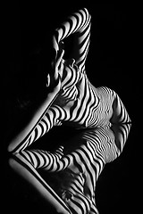 Image showing The nude woman with black and white zebra stripes