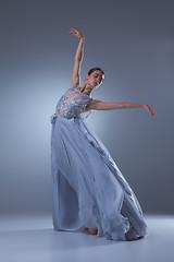 Image showing The beautiful ballerina dancing in blue long dress 