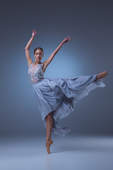 Image showing The beautiful ballerina dancing in blue long dress 