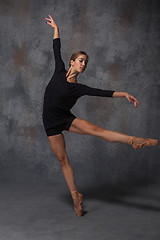 Image showing Young beautiful modern style dancer posing on a studio background