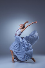 Image showing The beautiful ballerina dancing in blue long dress 