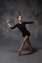 Image showing Young beautiful modern style dancer posing on a studio background