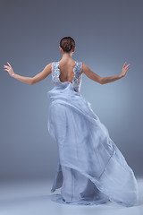 Image showing The beautiful ballerina dancing in blue long dress 