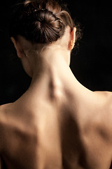 Image showing Beautiful woman, back view on dack background