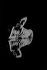 Image showing The nude woman with black and white zebra stripes