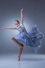 Image showing The beautiful ballerina dancing in blue long dress 