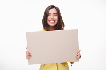 Image showing Businesswoman showing board or banner with copy space on white background 