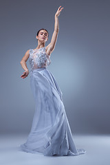 Image showing The beautiful ballerina dancing in blue long dress 