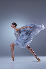 Image showing The beautiful ballerina dancing in blue long dress 