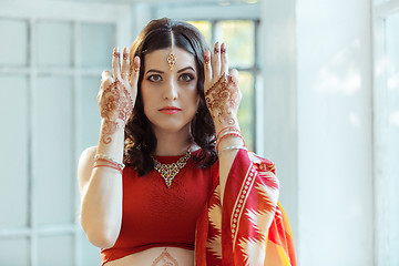 Image showing Indian picture on woman hands, mehendi tradition decoration