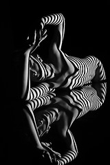 Image showing The nude woman with black and white zebra stripes