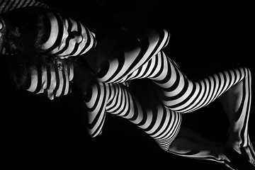 Image showing The nude woman with black and white zebra stripes