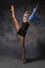 Image showing Young beautiful modern style dancer posing on a studio background