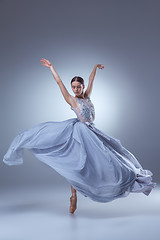 Image showing The beautiful ballerina dancing in blue long dress 