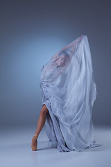 Image showing The beautiful ballerina dancing in blue long dress 