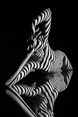 Image showing The nude woman with black and white zebra stripes