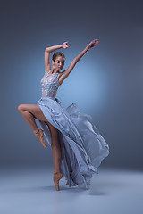 Image showing The beautiful ballerina dancing in blue long dress 