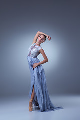 Image showing The beautiful ballerina dancing in blue long dress 