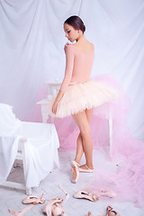 Image showing Professional ballet dancer posing on pink