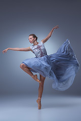 Image showing The beautiful ballerina dancing in blue long dress 