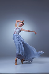 Image showing The beautiful ballerina dancing in blue long dress 