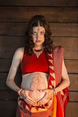 Image showing The pregnant woman with henna tattoo