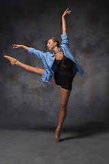 Image showing Young beautiful modern style dancer posing on a studio background