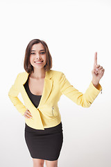 Image showing young business woman showing something on the white background
