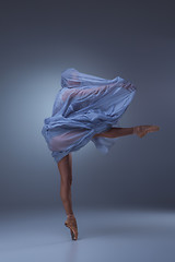 Image showing The beautiful ballerina dancing in blue long dress 