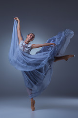 Image showing The beautiful ballerina dancing in blue long dress 