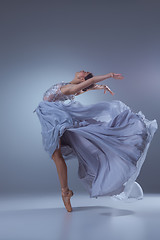 Image showing The beautiful ballerina dancing in blue long dress 