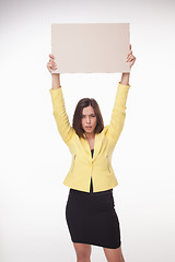 Image showing Businesswoman showing board or banner with copy space on white background 