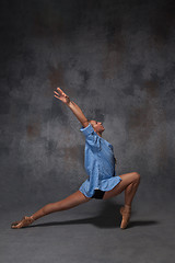 Image showing Young beautiful modern style dancer posing on a studio background