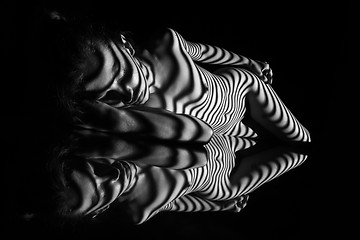 Image showing The nude woman with black and white zebra stripes