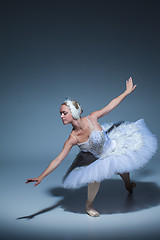 Image showing Portrait of the ballerina in ballet tatu on blue background