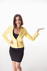 Image showing young business woman showing something on the white background