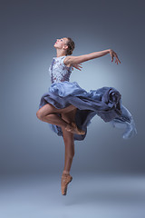 Image showing The beautiful ballerina dancing in blue long dress 